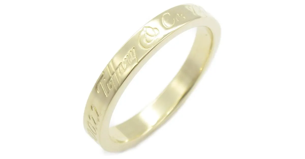 Anillo Estrecho Tiffany & Co. Notes Dorado 
