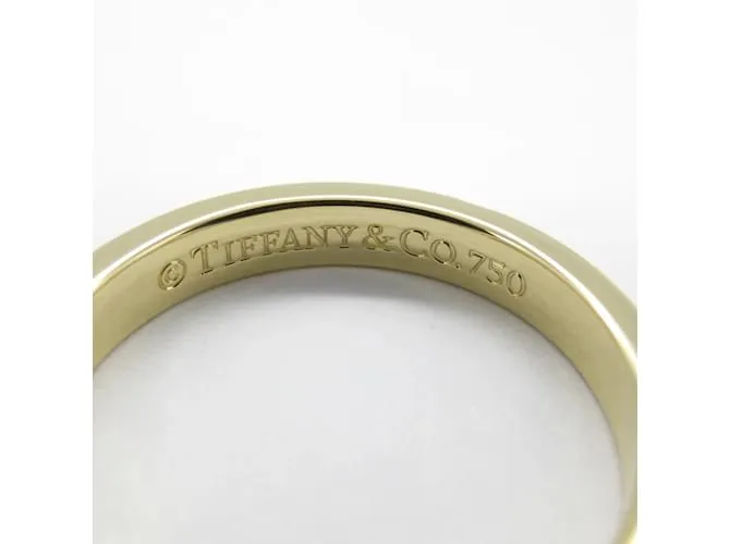 Anillo Estrecho Tiffany & Co. Notes Dorado 