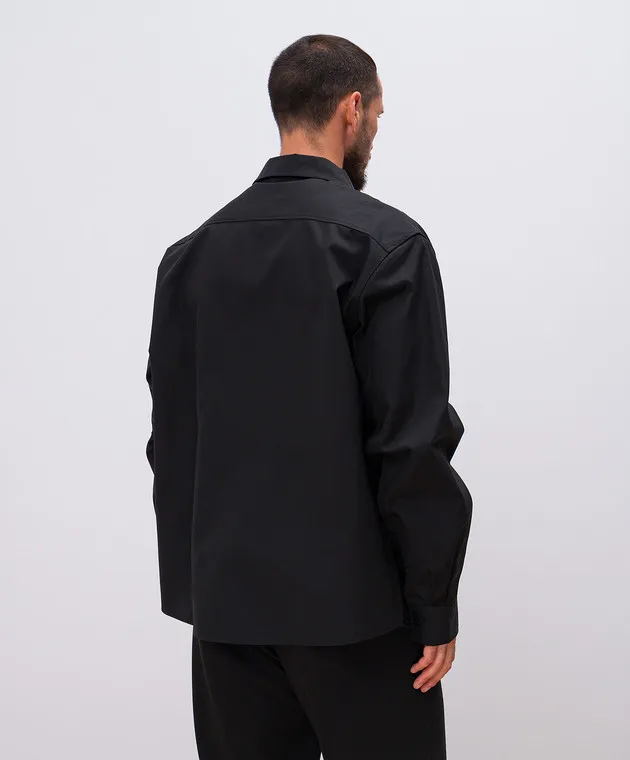 Axel Arigato A black shirt with an embroidered logo