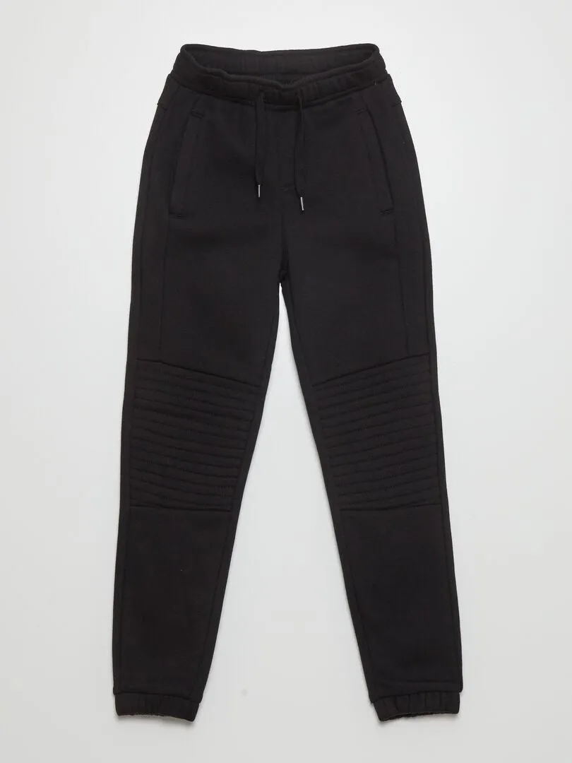 PANTALóN DE CHáNDAL TIPO JOGGING  CORTE MáS AJUSTADO  NEGRO